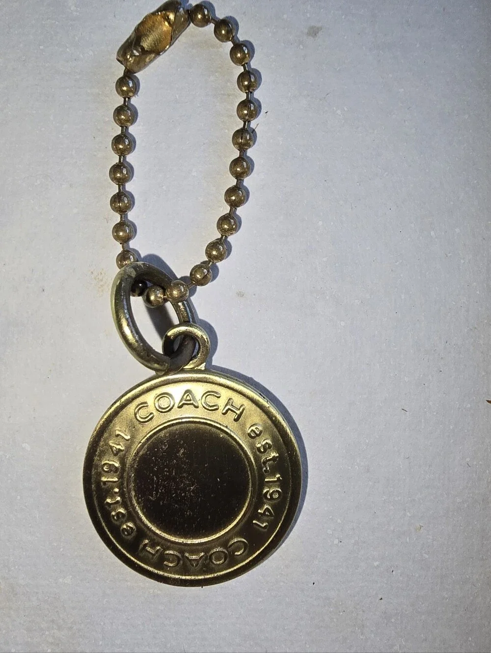 Coach Gold Tone Pendant Est 1941